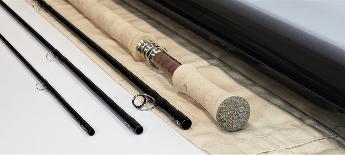 Winston Spey Rod - 4pc on rod sheeth next to rod tube on a white surface